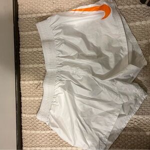 Nike White Athletic Shorts with Orange Swoosh